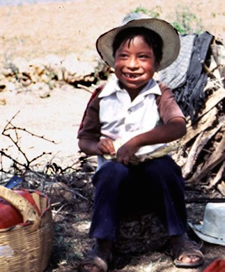 Seven-year-old Zapotec boy eating a tortilla in the fields of Oaxaca, Mexico, near the village of La Paz. (D. P. Fry photo collection)