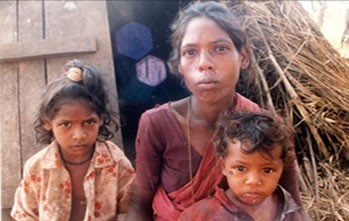 Paliyan woman in the Sirumalai Hills Tamil Nadu, with her children.