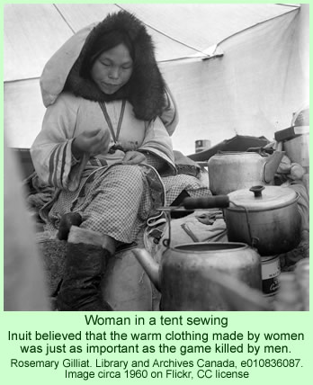 Inuit woman sewing