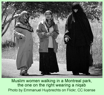 Muslim women in a park, one wearing a niqab