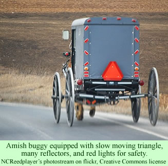 Amish buggy with slow moving triangle