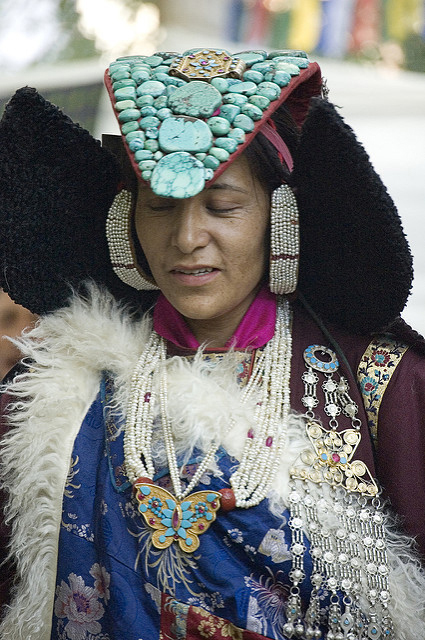 The traditional clothing and headdress, called a perak, of a Ladakhi Buddhist woman