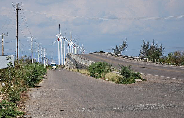 Wind turbines tower above the highway a few miles northeast of the Zapotec city of Juchitán de Zaragoza