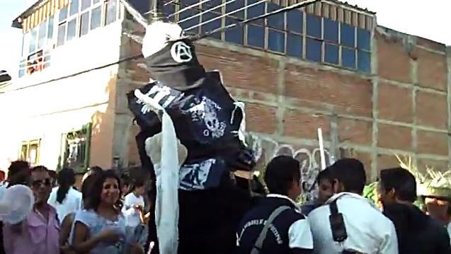 A large puppet moves with the crowd in the People’s Guelaguetza on the streets of downtown Oaxaca in 2011