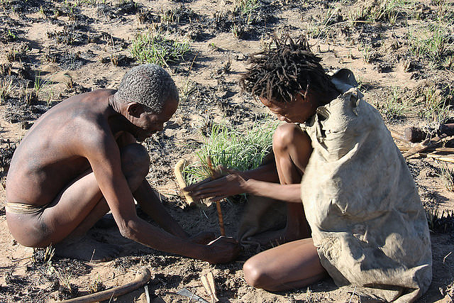 Ju/’hoansi starting a fire for tourists at the “Little Hunter’s Museum” of the Ju/’hoansi San in //Xa/oba, the Nyae Nyae Conservancy of Namibia