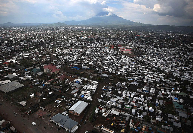 The city of Goma, with the Nyiragongo Volcano looming on the northern horizon (Photo by MONUSCO / Abel Kavanagh in Wikimedia, Creative Commons license)