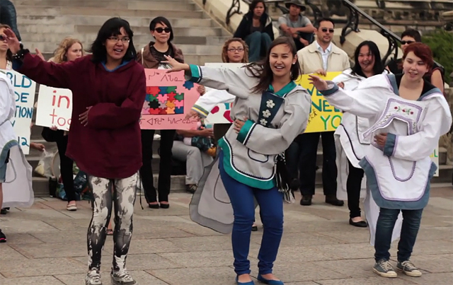 Inuit young people displaying their support for their traditional culture by dancing at a demonstration on Parliament Hill in Ottawa