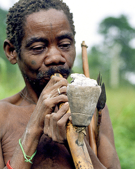 Mbuti man smoking a traditional pipe, probably with marijuana (Photo by Marc Louwes on Flickr, Creative Commons license)