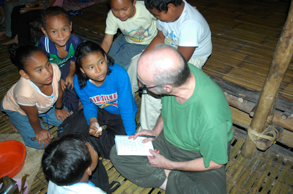 Semai children crowd around Robert Knox Dentan to grill him about proper English usage (Photo in an article by Dentan with a Creative Commons license)