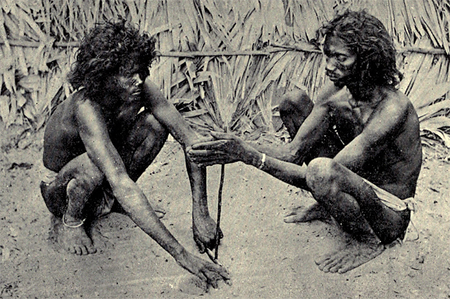 Two Yanadi men making fire in front of one of their huts (Photo from Edgar Thurston, Castes and Tribes of Southern India, Madras Government Press, 1909, vol. 7, p.418. In the public domain)