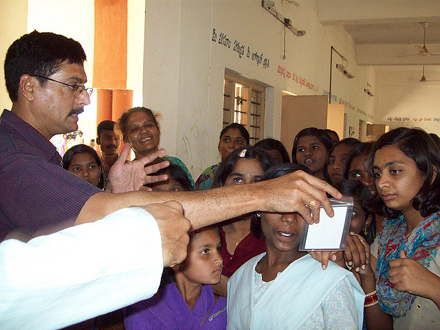An instructor explaining a test for water quality at a Kasturba Gandhi Balikala Vidyalaya school in Andhra Pradesh 