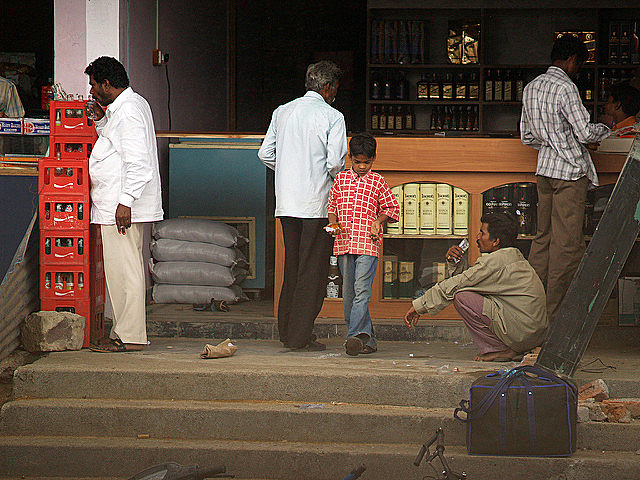 A young boy buying liquor at a store in Nizamabad, near Andhra Pradesh 