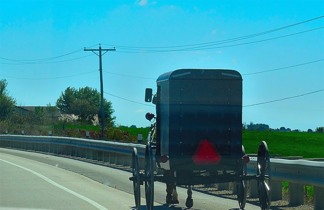 Amish buggy driven beside the road on U.S. highway 61 in Grant County, Wisconsin 