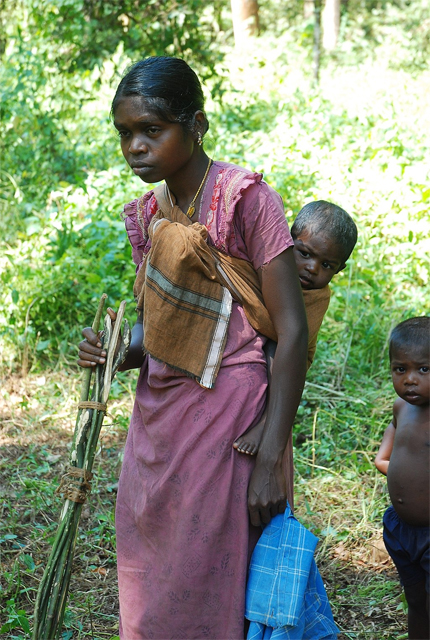 A Kadar woman with two children
