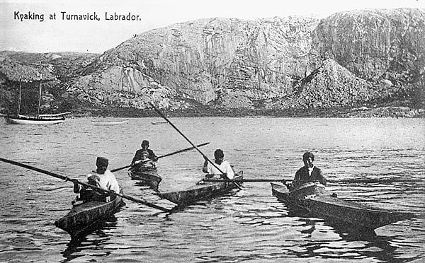 Four men kayaking at Turnavik, on the coast of Labrador 80 miles north of Rigolet, between Hopedale and Makkovik 