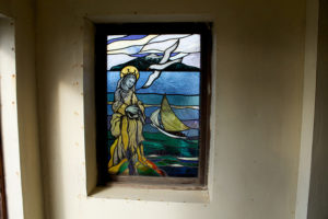 The albatross stained glass window depicting Mary, Star of the Sea, in St. Joseph’s Catholic Church