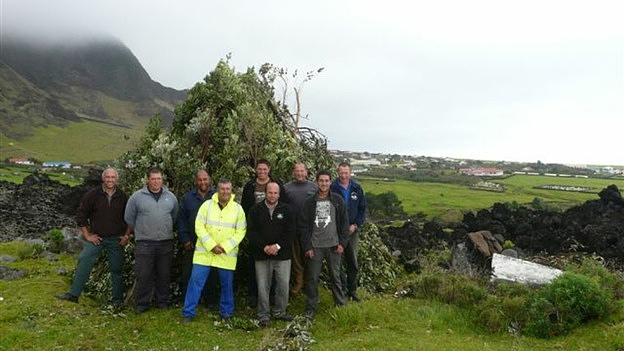 The Tristan Islanders worked together to gather and burn harmful invasive plants, serving as a beacon to celebrate the Queen’s diamond jubilee, June 4, 2012