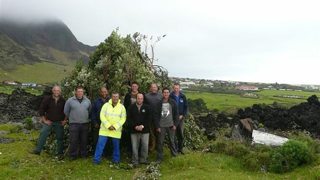 The Tristan Islanders worked together to gather and burn harmful invasive plants, serving as a beacon to celebrate the Queen’s diamond jubilee, June 4, 2012 