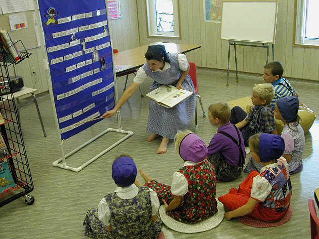 The students at a Hutterite school pay rapt attention to their teacher 