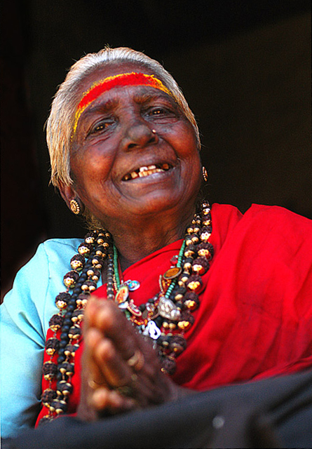 Lady at Sabarimala, probably Malapandaram, selling traditional healing oils made from forest herbs 