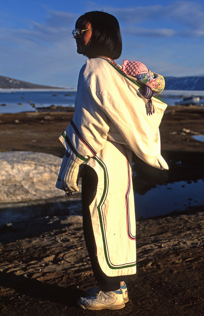 An Inuit woman carrying her child in Clyde River, Nunavut, in 2013 