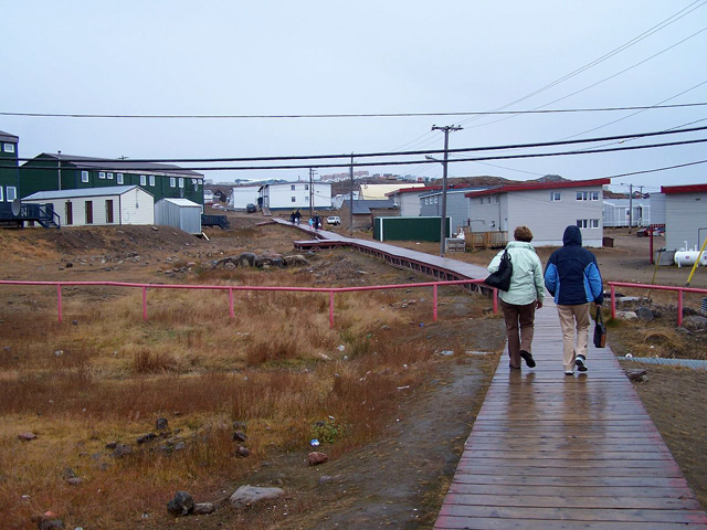 Two people on a boardwalk in Iqaluit 