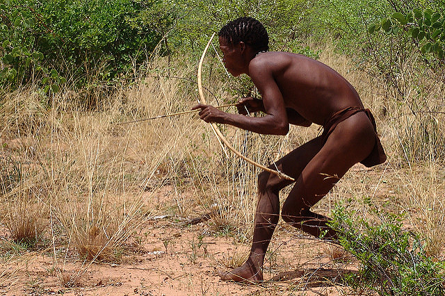 A San hunter in Namibia using his traditional bow and arrow