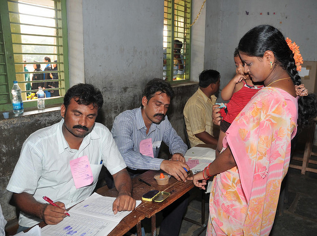 An official puts indelible ink on the finger of a voter in Andhra Pradesh in the April 2009 general election 
