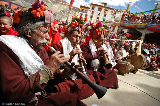 Ladakhi men playing their horns at a festival 