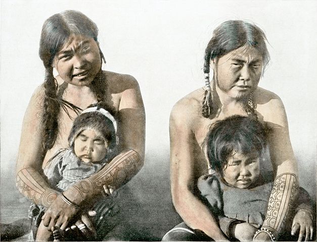 Eskimo women from King’s Island, Alaska, with striking tattoos on their arms in 1910 
