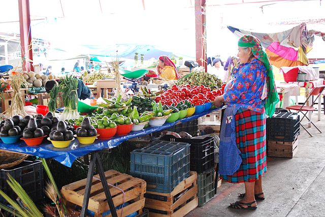 A woman selling fruits and vegetables in the Tlacolula market 