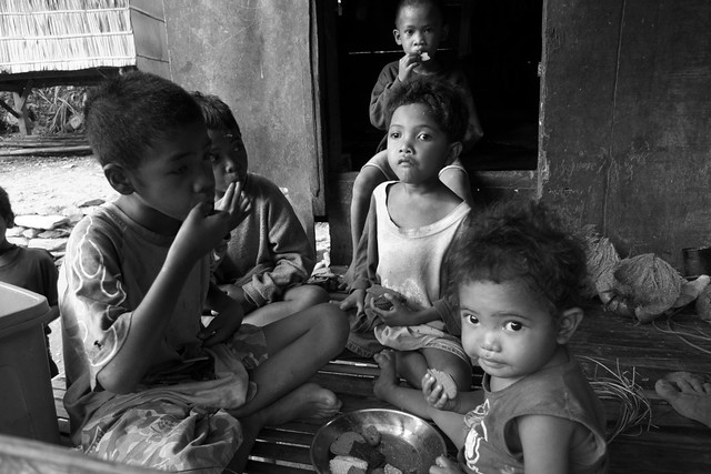 Mangyan children eating biscuits 