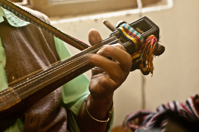 Sonam Lepcha playing a self-designed, four-string musical instrument